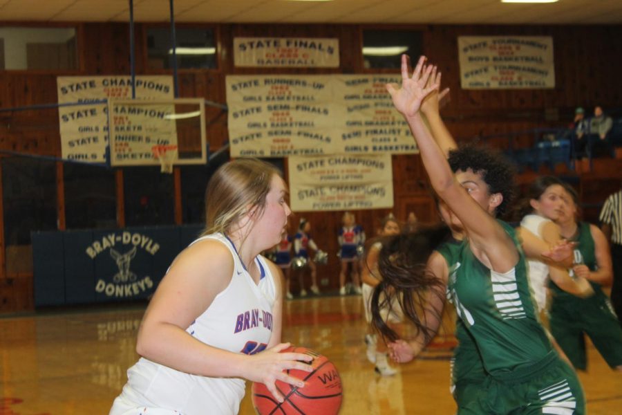 Kyndalin Byrd looks to drive baseline against OSD Monday November 26. 