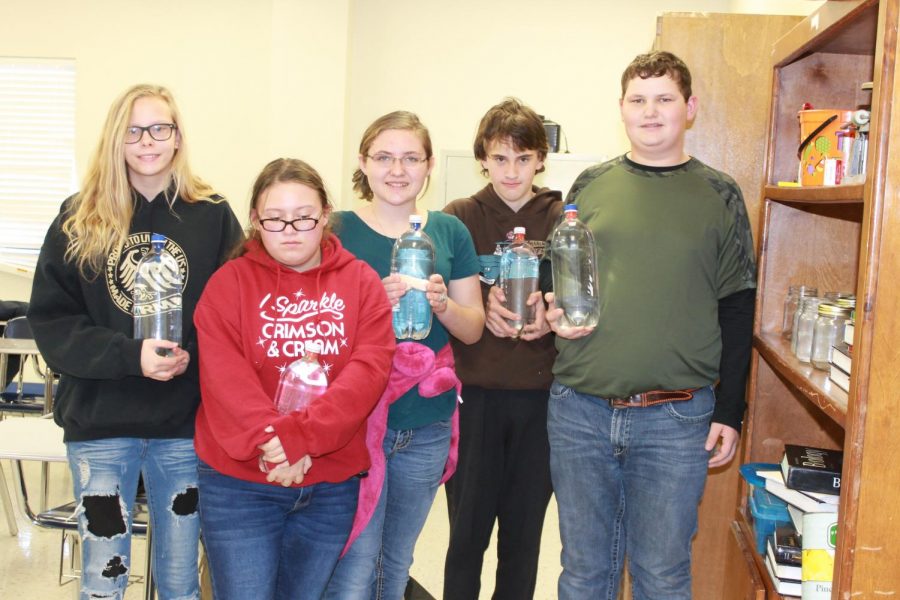 Mr. Mitchell’s sixth hour, 8th grade science remediation class stand with their science experiments. From left Sara Boatman, Madison Smith, Trinity Smith, Tyler Bartlett, Aubrey Bratcher