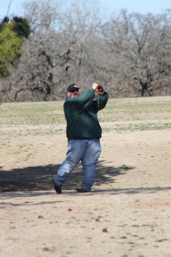 Josh Long hits a ball down the fairway during Saturday's Bray-Doyle After Prom golf scramble at Twin Oaks golf course. 