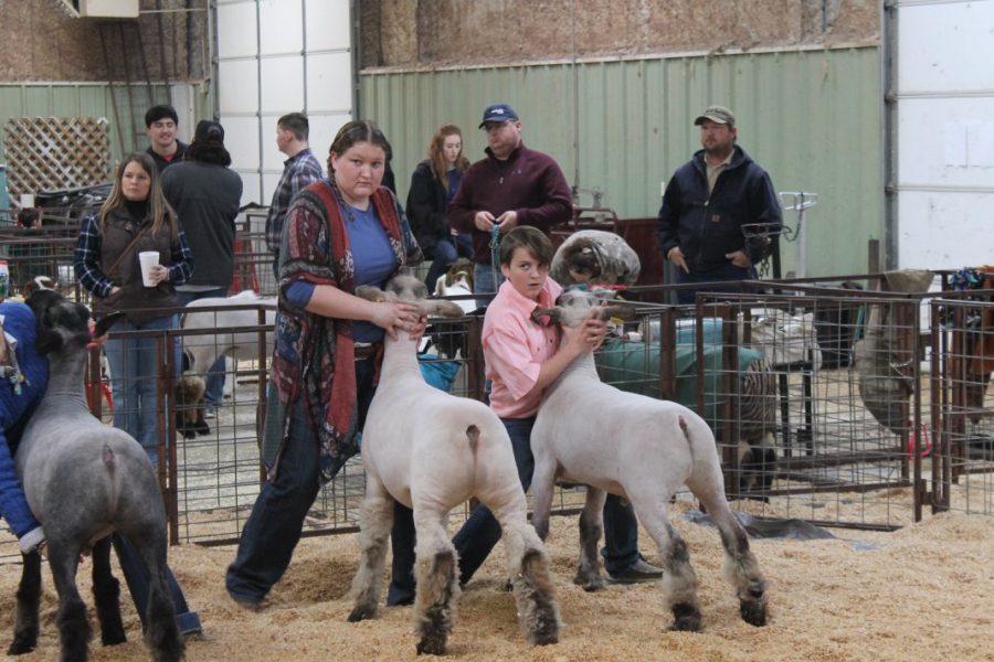 Aundrea Bratcher and Ethan Fisher stand waiting for results during the Bray-Doyle local show. 