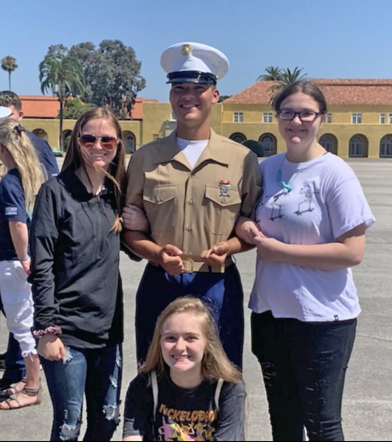  Mark Eldridge stands with sisters, from left Jade, Morgan and Angel after graduation from the Marine Corp on Friday, August 9. 