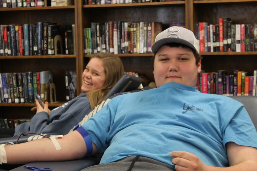 Cole Talley and Haillee Carroll donate blood during the FCCLA blood drive. 