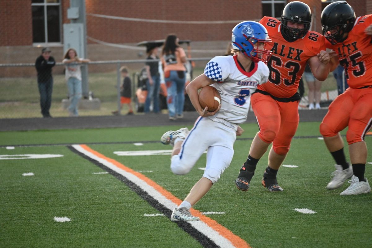 Bladyn Harris looks to move the ball up the field against Alex. 